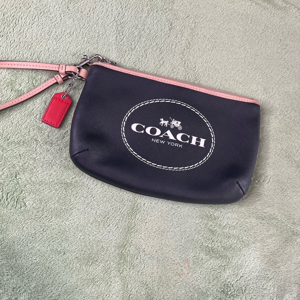 Coach black Leather Wristlet with tan Trim and Red Tag